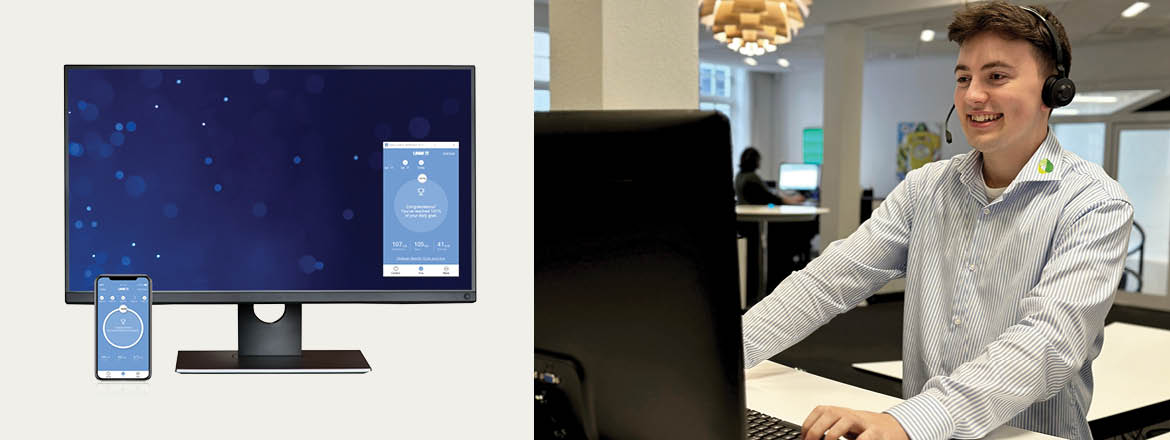 手机和电脑上的 Desk Control™ 应用程序，微笑的ipnordic 员工站立在坐站结合升降桌前