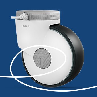 带有 LINAK 标志的灰色 WeAssist™ 脚轮：智能技术实现智能医疗床的操控。