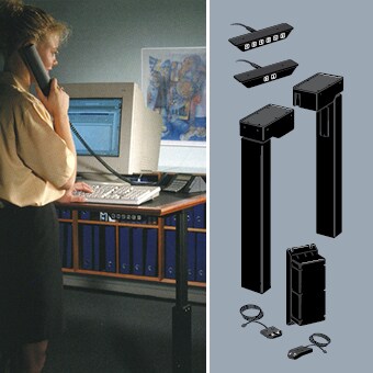 办公室人员在使用升降办公桌。DL1: LINAK 推出革命性“电动升降桌腿”。